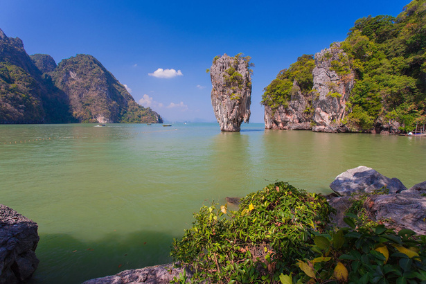 rock formations in the water near the shore of a body of water